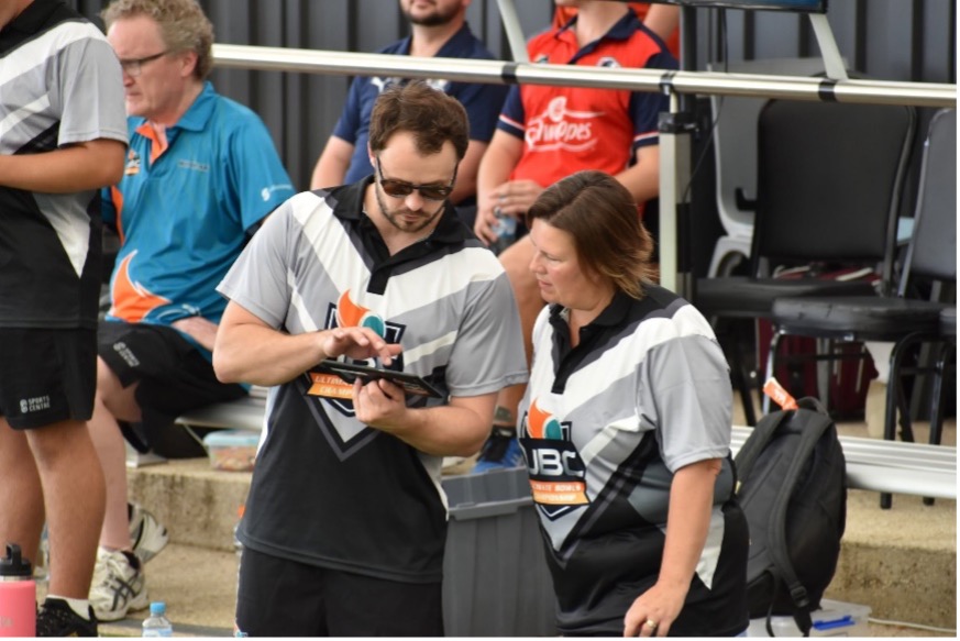 Two UBC volunteers working together on a tablet