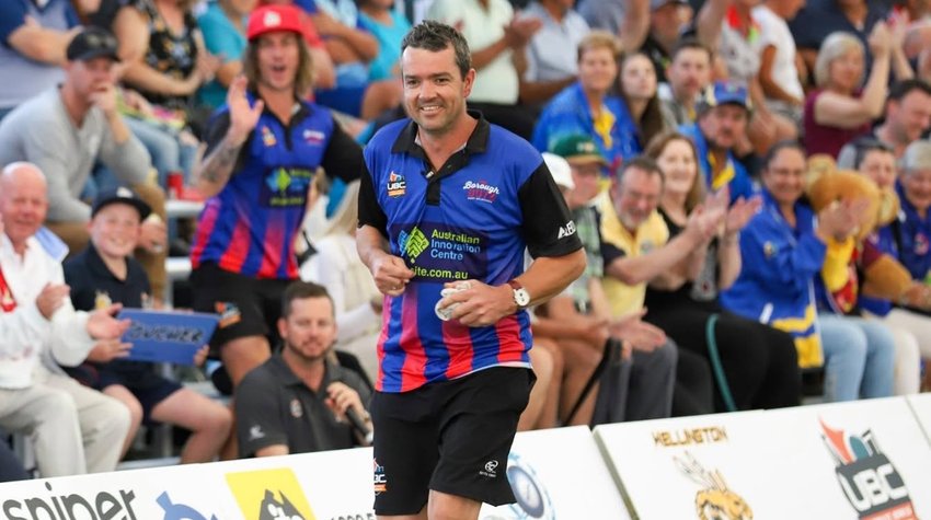 Player jogging along the rink in front of a cheering grandstand crowd during the inaugural 2019 championship
